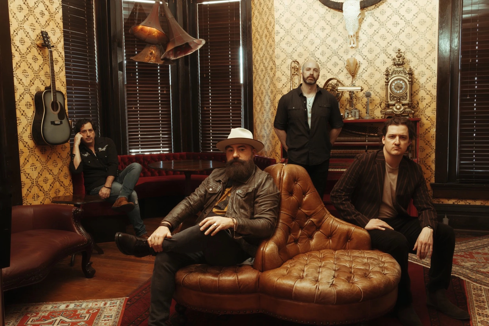 The four members of Brother Maven in a vintage music room