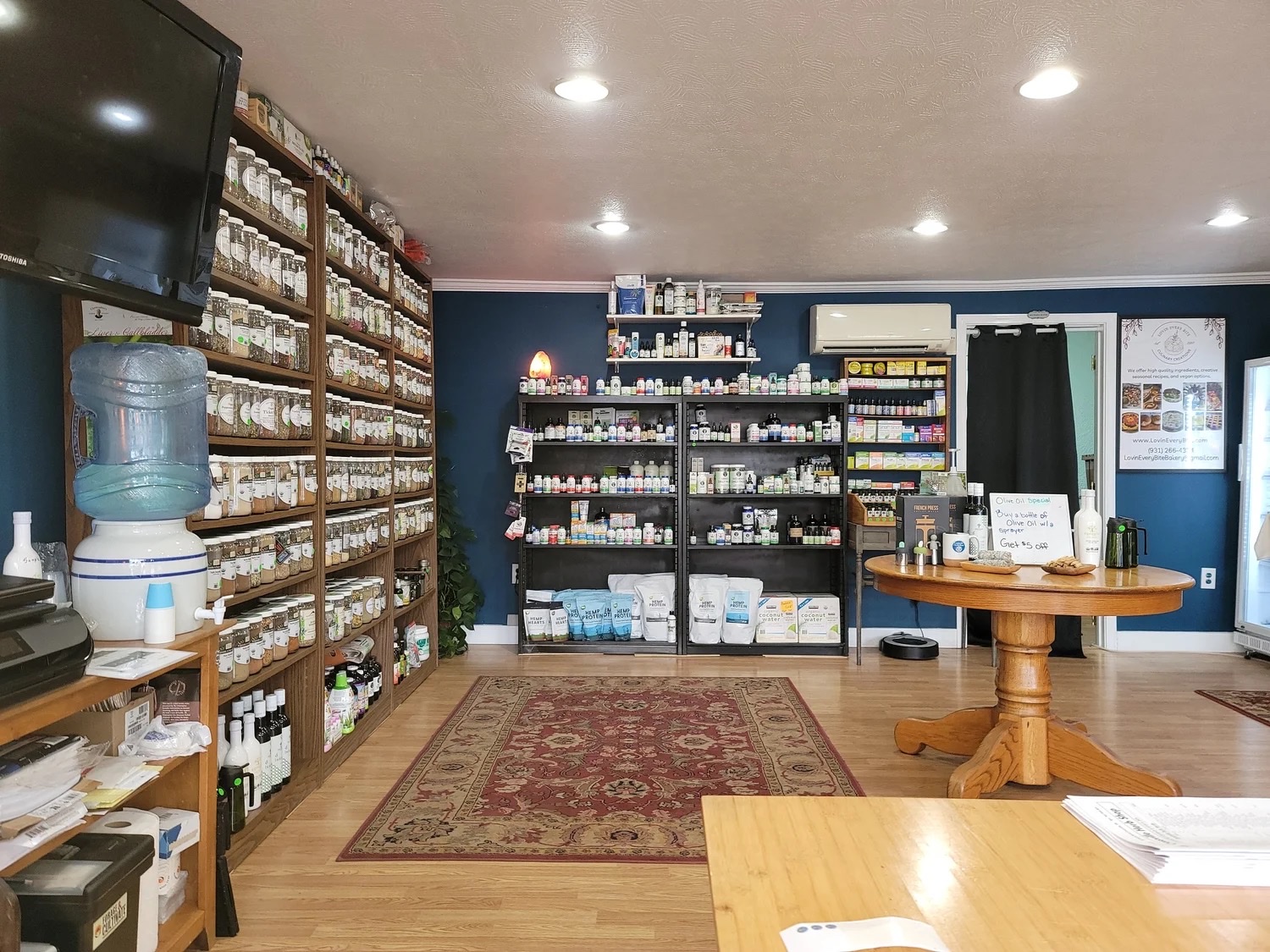 Shelves of herbs and wellness products inside Crossville Herb Shop